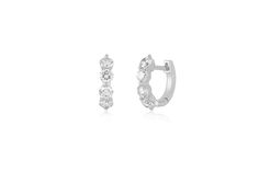 The Jumbo Prong Set Diamond Mini Huggie Earring stands out thanks to the 4 round diamonds per earring, each set with only 3 prongs so you see as much diamond as possible. Available as a single or a classic pair, these huggies can be mixed, matched, and even worn side-by-side as Emily likes to do.