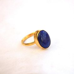 Lapis Lazuli Yellow Gold Ring-9K,14K,18K,22K Solid Gold Rings-January Birthstone Gold Ring -Gold Wedding Ring -Yellow Gold Ring- Lapis Ring Available in 9K,14k,18K,22K yellow solid gold bezel and solid yellow gold ring are both shined to an extremely high polish. But if you prefer it in matte convo me after purchasing. The main stone is natural Lapis Lazuli Gemstone. The pictures have been enlarged to show the details. The band is about 2 mm wide and 1 mm thick. This ring is made to order in you Oval Gemstone Gold Stackable Rings, Gold Rings With Gemstone For Fine Jewelry, Gold Crystal Gemstone Ring For Promise, Gold Crystal Gemstone Promise Ring, Gold Signet Ring With Gemstone For Promise, Gold Crystal Promise Ring With Gemstone, Classic Gold Opal Gemstone Ring, Gold Crystal Ring With Bezel Setting As Gift, Handmade Gold Oval Stackable Rings