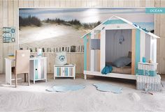 a child's bedroom with a beach theme