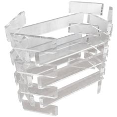 a stack of clear acrylic shelves on top of each other in front of a white background