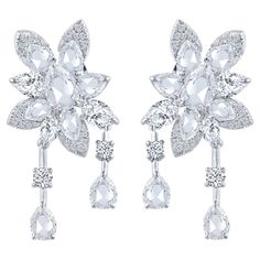 A beautiful arrangement of brilliant and rose cut diamonds come together to create these drop earrings which is a part of our Cascade collection. Studded with 44 round, 6 pear and 16 rose cut pear diamonds. Inspired by the beauty of the naturally flowing waterfall, these dangling earrings from our Cascade Collection are crafted in 18 KT white gold and can be secured comfortably with omega and guardian post. Drawing from a century of expertise in the diamond and jewelry industry, HARAKH was launc Art Jewelry Design, Colorless Diamond, Pear Diamond, Dangling Earrings, Rose Cut Diamond, Rose Cut, Luxury Jewelry, Jewelry Art, Precious Stones