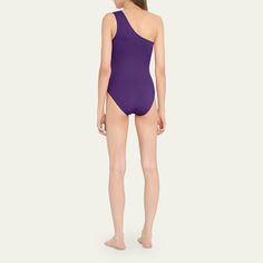 Eres "Effigie" solid one-piece swimsuit. One-shoulder neckline. High-cut legs. Moderate seat coverage. Nylon/spandex. Made in Italy. One Shoulder Stretch Nylon Swimwear, One Shoulder Nylon Swimwear For Poolside, One Shoulder Beachwear Bodysuit For Swimming, Stretch Bodysuit With Asymmetrical Neckline And Lined Body, One Shoulder Lined Body Swimwear, One Shoulder Stretch Bodysuit For Swimming, Solid Asymmetrical Neckline Swimwear With Stretch, One Shoulder Stretch One Piece For Poolside, Stretch One Shoulder One Piece For Pool