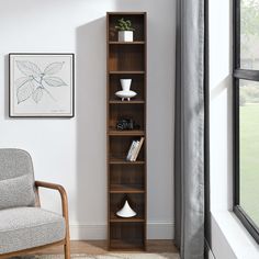 a living room scene with focus on the bookcase and chair in the foreground