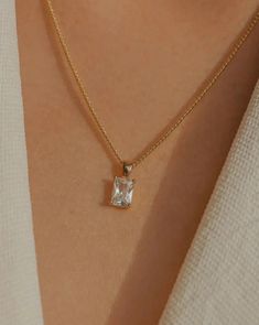 Simple, graceful, and minimalistic, this piece features a rectangular clear crystal CZ stone suspended on the daintiest gold chain. Made with 100% gold-filled materials, she is truly an everyday necklace that you can wear whenever and wherever your heard desires — even in the shower. …………………………………. D E T A I L S • Pendant measures 5 x 13 mm • Tarnish-resistant, waterproof, safe for sensitive skin • 1.5mm width curb chain with spring clasp • 100% 18k gold-filled Soft Toothbrush, Everyday Necklace, Sparkling Crystal, Gold Filled Jewelry, Curb Chain, Cz Stone, Gold Plated Jewelry, Jewelry Plate, Gemstone Necklace