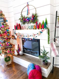 a decorated christmas tree in the corner of a living room next to a fire place