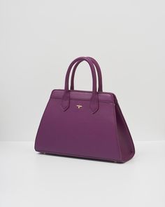 Our classic tote has been beautifully updated with our Floral Engravings Print. Crafted from recycled faux leather in plum and featuring a twilly scarf wrapped around the handle. With ample space and luxe gold-tone hardware, it’s perfect for carrying books and souvenirs from your favorite exhibitions.

Key features:


Outer: 100% Polyurethane; Lining: 100% Polyester Scarf: 100% Polyester



Approx. 34 (L) x 21 (H) x 12 (D) cm



Wipe clean with a damp cloth Luxury Christmas Gifts, Twilly Scarf, Polyester Scarf, Twilly, Scarf Wrap, Plum, Animal Lover, Faux Leather, Tote Bag