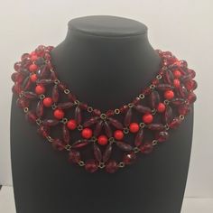 264.00 USD Red glass and Lucite bib beaded statement choker necklace in very good vintage condition. Measures 14 1/2 inches long and has red rhinestones on the clasp. Very pretty unique mid century piece. Perfect for any little black dress or nice outfit. Vintage Red Choker For Party, Vintage Red Choker Jewelry, Red Vintage Choker Jewelry, Red Choker Necklaces For Formal Occasions, Red Choker Necklace For Formal Occasions, Formal Red Choker Necklaces, Formal Red Choker Necklace, Vintage Red Faceted Beads Jewelry, Red Beaded Bib Necklace