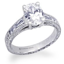 a white gold engagement ring with baguettes and side stones