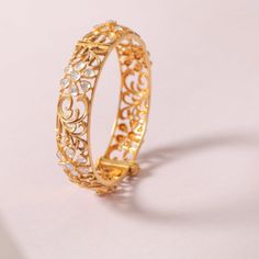 Description Modern | Elegant | Chic Inspired by the most popular baroque patterns, this collection is crafted in 3d carvings of flora and fauna. The combination of Moissanites and unique gold plating enhances its sparkle. The pieces are lightweight and perfect for both traditional and contemporary styles. This splendid and ultra-charming silver bangle cuff is handcrafted with floral motifs set in Moissanites and golden baroque floral patterns which, in turn, is the central focus of this elegant Exquisite Bracelets With Intricate Design, Luxury Festive Bracelets, Ornate Gold Hand-set Bracelets, Luxury Gold Jewelry For Festive Season, Ornate Handcrafted Gold Bracelets, Luxury Formal Bangle For Festive Occasions, Luxury Formal Festive Bangle, Luxury Bangle For Formal Festive Occasions, Festive Luxury Gold Jewelry