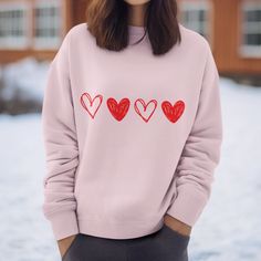 "Introducing our valentines sweatshirt - A Must-Have Addition to Your Wardrobe! Experience the ultimate in cozy comfort with our specially crafted sweatshirt. Designed with your utmost comfort in mind, this sweatshirt is perfect for those who appreciate quality, style, and functionality. 🌟 Key Features 🌟 🔹 Seamless Perfection: Say goodbye to irritating side seams, ensuring a smooth and comfortable fit all day long. 🔹 Ribbed Knit Collar: The ribbed knit collar not only adds a touch of sophistication but also provides extra durability. It's the perfect blend of style and substance. 🔹 Premium Materials: Made from a blend of 50% cotton and 50% polyester, our sweatshirt offers the ideal combination of softness and durability. 🌬️ Easy Care Instructions 🌬️ ✅ Machine Wash: Cold water is all Relaxed Fit Long Sleeve Hoodie As Gift, Long Sleeve Relaxed Fit Hoodie As Gift, Cotton Long Sleeve Sweater With Heart Print, Cute Sweatshirt With Heart Graphic And Crew Neck, Cute Crew Neck Sweatshirt With Heart Graphic, Trendy Valentine's Day Sweater With Heart Print, Trendy Heart Print Sweater For Valentine's Day, Casual Hoodie Sweatshirt For Gift, Valentine's Day Cotton Sweatshirt Gift