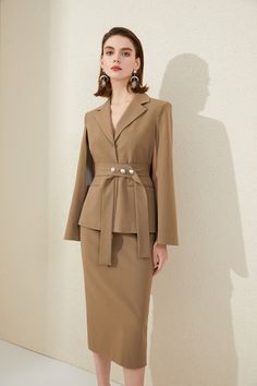 Chocolate Brown Cape Sleeve Blazer Skirt Suit Description: Peak lapels; front button blazer Structured shoulders. No pockets. Midi Skirt V-Neck, cape sleeves; buttons Structured shoulders. Chest welt pockets. Hip flap pockets Polyester 63% Viscose 33% Spandex 4% Imported Brand - Aision Model Number - 213203C3+S1 Luxury Blazer Dress With Pressed Crease For Fall, Luxury Brown Three-piece Suit For Work, Luxury Tailored Beige Skirt Suit, Luxury Beige Skirt Suit For Formal Occasions, Luxury Fitted Beige Skirt Suit, Luxury Knee-length Office Blazer, Luxury Brown Skirt Suit For Fall, Luxury Elegant Capelet For Workwear, Luxury Notch Lapel Skirt Suit For Fall