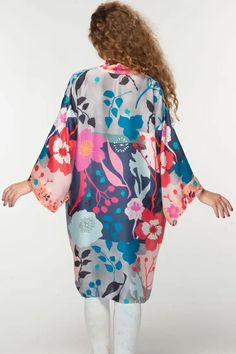 This elegant Malini kimono, by our friends at Sevya Handmade, is crafted with 100% Cupro material for a luxurious yet sustainable option. Its lightweight, breathable composition gives it a similar silk-like feel while significantly reducing care needs. Free-size designed with a floral pattern, this fair-trade garment will provide you with long-lasting comfort. Sevya, derived from Sanskrit, translates to "caring through service". Dedication to preserving India's unique arts and cultures is shown Silk V-neck Kimono For Daywear, Silk V-neck Summer Robe, Spring Satin V-neck Robe, Summer Silk Wrap Kimono, Summer Silk Kimono Flowy Fit, Multicolor Silk Robe For Spring, Silk Wrap Kimono, Flowy Silk Summer Kimono, Flowy Silk Kimono For Summer