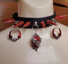 "Version 1 features red and silver bat charms.  Version 2 features black and silver bat charms.  This handmade spiked choker features one center charm and two side charms, with tree spikes around the length. Made with Biothane unless otherwise specified, assembled and cut by hand. Resin spikes are poured by hand. 🖤Step 1: Choose your collar color.    -Biothane chokers and the sunflower faux leather are all 1 inch in width. Other printed patterns will range from 1 inch to 1.5 inch, and the two v Styl Emo, Bat Choker, Halloween Choker, Spiked Choker, Bling Ideas, Pressure Pot, Goth Accessories, Assassin Creed, Metal Spikes