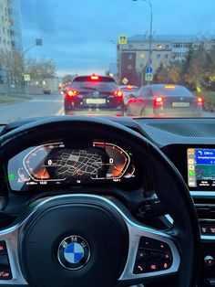 the dashboard of a bmw car on a city street