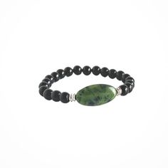 This Power Stone Bracelet is made with gorgeous, all natural, Green Jade and Black Onyx. This stone has been revered for centuries as a symbol of serenity and purity as well as a talisman for good luck and abundance. It has also been called a "dream stone" and said to bring the wearer insightful dreams. Chakra: HeartSignificance: 12th Anniversary gemstone Materials include: 15x30mm natural, high-quality Green Jade focal stone 8mm natural, high-quality Black Onyx stones zinc-alloy, silver colored metal accent beads strong stretch cord Note: Crystal descriptions are meant to support healing, not to provide prescription or healthcare information. Jade Bracelets With Natural Stones For Meditation, Spiritual Jade Beaded Bracelets For Everyday, Everyday Spiritual Jade Beaded Bracelets, Holistic Hand-strung Jade Jewelry, Holistic Jade Bracelets With Gemstone Beads, Holistic Jade Bracelet With Gemstone Beads, Spiritual Round Obsidian Bracelets, Spiritual Obsidian Round Bracelets, Spiritual Jade Stretch Bracelet For Meditation