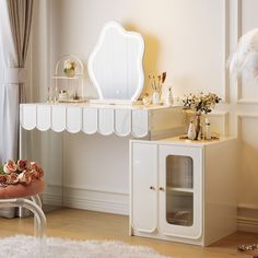 a white dressing table and mirror in a room