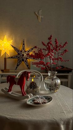 a table topped with christmas decorations and lights