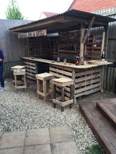 an outdoor bar made out of wooden pallets