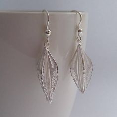 Filigree Earrings Plumas de Angel Light Sterling Silver Elegant Leaf-shaped Earrings For Gift, Elegant Leaf Shaped Earrings As Gift, Elegant White Leaf-shaped Earrings, Elegant Leaf-shaped Sterling Silver Earrings, White Filigree Drop Earrings, Leaf-shaped Earrings For Gift, Elegant Nickel-free Leaf-shaped Jewelry, Pierced Delicate Drop Earrings, Silver Leaf-shaped Pierced Earrings