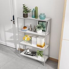 a shelf filled with books and vases on top of each other next to a door