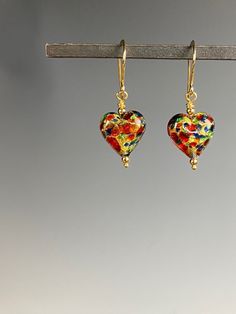 Sweet, sweet, sweet little earrings of genuine Italian Murano glass from the artisans in Murano, Italy! You will love these pretty little Murano earrings that are full of color and whimsy. Show them that you love them with these hearts of rainbow colors swirling and dancing. The glass has 14k gold foil within them to add to the sparkle of colors of gold, red, green and blue! These earrings are perfect for any outfit. Appropriate for a teen or young person as well. The hearts hang from gold Verme Pride Jewelry, Murano Glass Earrings, Glass Hearts, Pride Jewellery, Murano Glass Jewelry, Rainbow Hearts, Murano Italy, Italian Jewelry, Glass Pendant Necklace