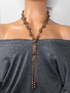 Discover elegance with our handcrafted glass pearl crochet bubble stitch beaded necklace. This unique piece combines the intricacy of crochet with the beauty of glass pearls, creating a stunning accessory perfect for any occasion. The bubble stitch technique adds texture and dimension, making this necklace a standout choice for bohemian and chic style lovers. Whether you're dressing up for a special event or adding flair to your everyday outfit, this necklace is designed to impress. Treat yourself or gift it to a loved one to add a touch of artisanal charm to any jewelry collection. This simple design has a blend of elegance and boho chic that makes it easy to dress up or down for any occasion. Measuring 60 inches this beautiful crochet necklace is a wraparound tie-on necklace, great for w Pearl Crochet, Bubble Stitch, Bohemian Style Jewelry, Everyday Outfit, Beautiful Crochet, Style Jewelry, Simple Design, Special Event, Everyday Outfits