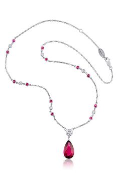 Bezel-set diamonds and rubies line the chain of this platinum necklace showcasing a central rubellite tourmaline pendant. 18" length Lobster clasp closure Total rubellite tourmaline weight: 5.74ct. Total ruby weight: 0.75ct. Total diamond weight: 1.15ct. Platinum/rubellite tourmaline/diamond/ruby Made in the USA >Diamond Guide Ruby Jewelry Necklaces, Diamond By The Yard, Platinum Necklace, Ruby And Diamond Necklace, Pretty Accessories, Rubellite Tourmaline, Bridal Diamond Jewellery, Diamond Necklace Set, Tourmaline Pendant