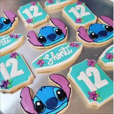 some decorated cookies with the names of two different characters and numbers are on a tray