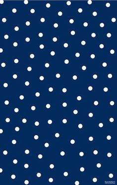 a blue background with white polka dots