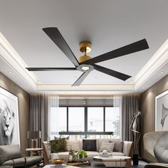 a living room with couches, chairs and a ceiling fan in the middle of it