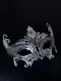 Step into the world of upscale glamour with our exquisite women's silver metal masquerade mask. The mask's silver shimmer adds an air of elegance, reflecting the light and adding a touch of enchantment to your appearance.

Age Group/Gender - Adult/Unisex

Size/Type - One size fits all adults

Mask Color - Silver

Shimmer Color - Silver

Mask Material - Lasercut Metal

Special Features - Rhinestones Silver Rhinestone Eye Mask For Masquerade, Silver Rhinestone Eye Masquerade Mask, Elegant Silver Eye Mask, Silver Rhinestone Masquerade Mask For Costume Party, Silver Masquerade Mask With Rhinestones For Costume Party, Elegant Silver Masks And Prosthetics For Party, Silver Party Mask, Elegant Adjustable Masquerade Mask For Mardi Gras, Silver Formal Masquerade Mask For Carnival