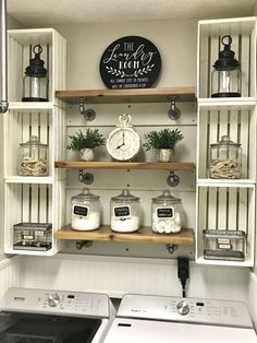 a washer and dryer in a laundry room with shelves above the washer