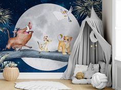 a child's room with a wall mural featuring animals on a tree branch and the moon in the background