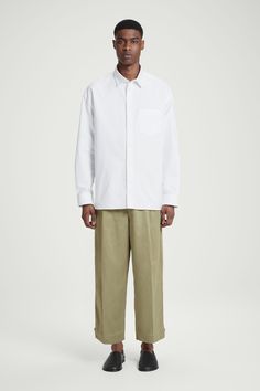 These modern pants will become a staple of your casual wardrobe. They're made from TENCEL™ Lyocell and organic cotton-blend twill and cut in a relaxed, barrel-leg shape with cropped hems that adjust with tabs for a neatened fit. There are practical pockets on the side and back. Relaxed fit, ankle lengthButton and zip closureBelt loops, front pleatsTENCEL™ is a trademark of Lenzing AG. TENCEL™ Lyocell is made from renewable wood sources, using a process that recycles 99% of all chemicals and water  Shell: 52% TENCEL™ Lyocell, 48% Organic cotton. Excluding trims / Machine wash Inside leg length of size 32R is 25.43" / Model wears a size 32R Relaxed Fit Chinos With Straight Hem, Modern Pants With Relaxed Fit And Straight Hem, Relaxed Cotton Pants With Straight Hem, Baggy Cotton Chinos For Work, Modern Cotton Bottoms With Straight Hem, Relaxed Cotton Bottoms For Workwear, Cotton Pants With Boxy Fit And Straight Leg, Cotton Straight Leg Boxy Fit Pants, Boxy Fit Cotton Straight Leg Pants