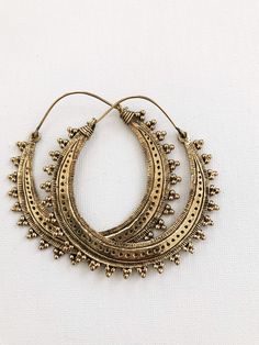 "Beautiful etched brass hoops on brass ear wire. DETAILS: Brass Hoops Size: 2.5\"L x2\" W Can be worn daily, brass will require occasional polishing. Ships with sample polishing cloth. *Packaged for gift giving. *Sold individually. Return to shop: Afrohemien.etsy.com Like and Follow Afrohemien for updates, sales, coupons and surprise giveaways Instagram/Blog: instagram.com/Afrohemien Tumblr: Afrohemien.tumblr.com Facebook: www.facebook.com/Afrohemien Twitter: twitter.com/Afrohemien" Bohemian Brass Earrings With Ear Wire, Bronze Brass Hoop Earrings With Ear Wire, Bronze Ear Wire Hoop Earrings In Brass, Vintage Brass Hoop Earrings With Ear Wire, Gold Small Hoop Plug Earrings In Brass, Artisan Gold Hoop Earrings For Festivals, Gold Colored Copper Earrings For Festivals, Bohemian Round Brass Plug Earrings, Vintage Brass Dangle Hoop Earrings