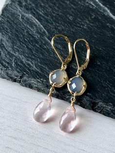 Rose Quartz and Gray Moonstone Earrings, Blush Pink Dangle Gold Earrings, Delicate Two Stone Drops Earrings, Elegant Gift for Girlfriend These blush elongated drop earrings feature gray moonstone hexagonal stones framed in 14k gold filled and suspended from them are micro faceted pastel pink rose quartz teardrops, wire wrapped in 14k Gold Filled. The Earrings are suspended from gold filled lever back ear wires. These are ideal for a night out, they are a great choice for causal wear and they wil Elegant Nickel-free Rose Quartz Earrings, Pink Rose Quartz Drop Earrings, Elegant Rose Quartz Gemstone Earrings, Elegant Teardrop Rose Quartz Earrings, Nickel Free Rose Quartz Jewelry, Elegant Rose Quartz Drop Earrings, Rose Quartz Gemstone Dangle Earrings, Rose Quartz Gemstone Drop Earrings, Rose Gold Drop Earrings With Gemstones