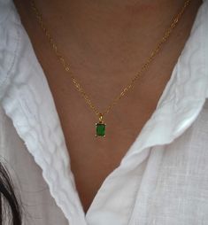 18k Gold Plated Emerald Green pendant hangs on a sturdy 18K gold plated stainless steel chain.  You choose your necklace length and the stone from the drop-down menu. Model wears 18 inches gold chain. Stone Options: -Emerald -Icy Blue -Clear -Navy Blue  DETAILS Pendant measures 5x7mm LENGTH CUSTOMIZATION You may choose your desired length from the drop-down menu or contact me for length customization. QUALITY My designs are tested and proven. My jewelry are made from 316L premium stainless steel, very strong and durable. They are hypoallergenic; very comfortable for sensitive skin and can last for many years and still retain the shiny appearance.  GIFT All items are beautifully gift wrapped! If this is a gift for a special someone and you would like to include a short message, please leave Gold Necklace Green Stone, Green Emerald Necklace, Emerald Green Necklace, Green Gemstone Necklace, Green Pendants, Gold Necklace Women, Emerald Pendant, Emerald Earrings, Green Necklace