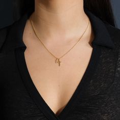 Two beautiful gold cross pendants hang from this delicate chain, giving it a little more flair than a traditional single cross necklace. It's an ideal gift for anyone who's about to celebrate a wedding, a confirmation or a First Communion. Made from high quality materials to last for years to come. Materials: 14K gold plated brass Features: Measures 16" with 2" extender, 10-14mm charms, Lead & Nickel free, lobster clasp Elegant Charm Necklace With Cross Pendant And Delicate Chain, Dainty Yellow Gold Cross Necklace With Adjustable Chain, Dainty Crucifix Necklace With Adjustable Chain, Yellow Gold Cross Charm Necklace With Adjustable Chain, Elegant Cross Charm Necklace With Adjustable Chain, Gold Plated Cross Necklace With Delicate Chain, Dainty Crucifix Clavicle Chain Necklaces, Dainty Crucifix Clavicle Chain Necklace, Yellow Gold Charm Necklace With Cross Pendant