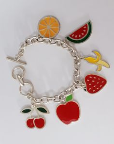 Handmade Bracelet Fruit Mix Charm Bracelet Womens Girls Boho Rainbow Colorful Enamel Charm Silver Tone Arty Modern Design Huge Toggle CLASP Everyone LOVES these handmade bracelets... FABULOUS Colorful fun happy festive pop art easy to wear and very durable. Fun JUMBO FRUIT charm, bracelet is 7 1/2 to 9 inches long total and has a jumbo sized toggle clasp THAT MAKES IT EASY FOR YOU TO GET OFF AND ON YOURSELF Great for Women and Girls. Bracelet is stainless steel hypoallegenic all safe metals. Exc Novelty Multicolor Charm Bracelet, Nickel-free Multicolor Novelty Jewelry, Novelty Multicolor Metal Jewelry, Trendy Multicolor Nickel Free Charm Bracelet, Trendy Multicolor Nickel-free Charm Bracelet, Retro Enamel Bracelets For Gift, Retro Enamel Bracelets For Gifts, Retro Multicolor Bracelet Jewelry, Retro Enamel Bracelet For Gift