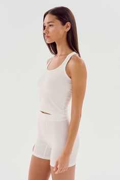 A cropped version of our fabulous Ashby tank. Super soft baby rib fabric hugs your body and layers effortlessly. BEST FOR: running, yoga, CrossFit, barre, Pilates, spin class, cycling and gym workouts. Cropped Seamless Tank Top For Workout, Compression Crop Top For Yoga In Summer, Summer Compression Yoga Crop Top, Summer Yoga Compression Crop Top, Athleisure Scoop Neck Crop Top For Yoga, Athleisure Scoop Neck Yoga Crop Top, Compressive Summer Tops For Pilates, Sporty Cropped Seamless Tank Top, Compressive Tops For Pilates In Summer