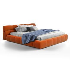 an orange and grey bed sitting on top of a white floor