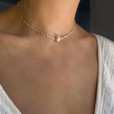 STERLING SILVER PEARL DROP CHAIN  This sterling silver pearl drop chain embodies coquette minimalist jewelry, offering a dainty and simple choker design. Its delicate elegance makes it the perfect necklace for her, whether as a thoughtful mother-daughter gift or a versatile everyday piece. ✔️ Material: Sterling silver and 8-10 mm round freshwater pearl ✔️ Length: from 14'' to 18'' (36- 46 cm)  ✔️ Hypoallergenic  ✔️Handcrafted in USA Each piece is handcrafted and may exhibit minor variations due Choker Design, Simple Choker, Choker Designs, Minimalist Accessories, Mother Daughter Gifts, Necklace For Her, Jewelry Dainty, White Jewelry, Delicate Necklace