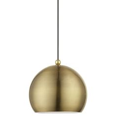 a brass colored pendant light hanging from a black cord