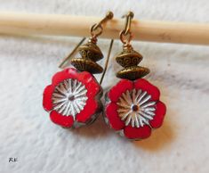 Red Flower Earrings, Red Dangle Earrings, Czech glass, Drop earrings, Red flowers, Rustic vintage brass, Boho chic, Bohemian,Romantic, gift for women, gift for mother Red Czech glass flower beads, are decorated with brass bronze spacer beads .. The length is 36mm (1.40 inches), including the antiqued brass earring wires. Earring wires can be changed. Please contact me if you want me to change the wires More flower jewelry: https://www.etsy.com/shop/wildstone?search_query=flowers Earrings: https: Handmade Czech Glass Flower Earrings In Vintage Style, Handmade Vintage Czech Glass Flower Earrings, Handmade Czech Glass Vintage Flower Earrings, Vintage Adjustable Dangle Flower Earrings, Red Bohemian Dangle Flower Earrings, Red Bohemian Soldered Earrings, Retro Flower Shaped Earrings For Gift, Retro Flower Shaped Earrings As Gift, Retro Flower Earrings For Gift