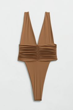 Our best-selling one-piece swimsuit! Equal parts sophisticated and sexy, the Echo One-Piece hugs your body and highlights your hips with a high-legged cut and minimal back coverage. The ruched side detail is met by moderate bust coverage and supportive shoulder straps. Super soft and super stretchy, this one-piece doubles as a bodysuit for an effortless beach-to-bar look. Just like an echo, you will want to repeat this purchase in every shade. Product description Minimal coverage front & back Do Party Swimwear With Ruched Sides, Party Swimwear With Ruched Sides And Stretch, High Cut Swimwear For Club And Summer, Summer Fitted Bodysuit With Ruched Back, Stretch Ruched Bodysuit For Swimming, Ruched Stretch Backless Swimwear, One-piece Ruched Bodysuit For Swimming, Party Swimwear With Ruched Back And Stretch, Ruched One-piece Swimming Bodysuit