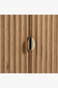 a close up of a wooden door with a metal handle on the front and side