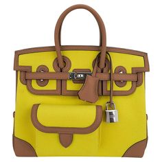 Mightychic offers an Hermes Cargo Birkin 25 bag featured in Jaune Citron and Chai. This Hermes very limited edition utility Birkin bag is created with Goeland canvas and Swift leather trim. Includes front and rear snap pockets, exterior credit card holder, and a pocket at the side gusset. Interior is canvas. Palladium hardware. NEW or NEVER WORN. final sale BAG MEASURES: LENGTH 25 cm / 9.25" TALL 18.5 cm/ 7.25" DEEP 13 cm / 5.25" HANDLES: TALL 3" CONDITION: NEW OR NEVER WORN Hermes Cargo, Cargo Birkin, Hermes Birkin 25, Birkin 25, Credit Card Holder, Hermes Birkin, Birkin Bag, Fashion Handbags, Leather Trims