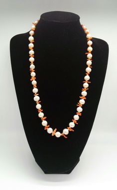 An absolutely stunning cultured pearl necklace enhanced with coral and gold beads. The pearls are of a super quality and colour and measure approx 1cm. The fixings and the beads are of 18ct gold (fully tested) Pearls are the birthstone for June or a third wedding anniversary, what a wonderful gift or treat this necklace would make. Length 27 inches 68 1/2 cms If you would like more details and or photographs please message me and I will be happy to answer any questions  The items for sale are in Elegant Coral Pearl Necklace With Round Beads, Elegant Orange Pearl Necklace Gift, Elegant Beaded Coral Pearl Necklace, Gift Coral Beaded Pearl Necklace, Coral Beaded Pearl Necklace As Gift, Orange Pearl Necklace As A Gift, Orange Pearl Necklace As Gift, Elegant Beaded Red Coral Pearl Necklace, Elegant Red Coral Beaded Pearl Necklace