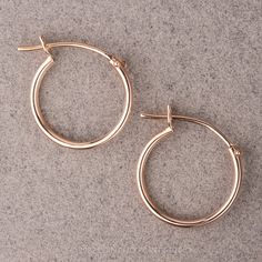 Timeless and chic, these 14k rose gold huggie hoop earrings are easy to wear and compliment existing jewelry that you wear everyday! They are finished with a snap and bar closure. Measuring 12.5mm these hoops can stand alone or be paired up with studs to elevate your look! The items comes packaged and ready for gift giving! Fabrication and Shipping:Please allow 5-10 business days before shipment of these earrings. We use USPS Priority mail for domestic orders which has a delivery time of 2-3 bus Rose Gold Huggie Jewelry With Spring Ring Clasp, Classic Small Hoop Rose Gold Huggie Earrings, Elegant Adjustable Rose Gold Huggie Earrings, Classic Rose Gold Small Hoop Huggie Earrings, Everyday Rose Gold Hoop Huggie Earrings, Minimalist 14k Rose Gold Huggie Earrings, Adjustable Rose Gold Hoop Earrings, Small Hoop Earrings In Rose Gold, Rose Gold Small Hoop Huggie Earrings For Everyday