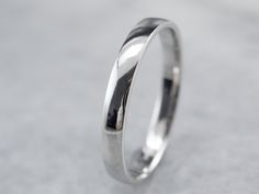 Simple and subtle, this platinum band features a low dome on top and a beautiful, soft polish. The profile and finish are completely un-decorated giving this piece a nice profile for a man or a woman. This band has a perfect polish and is ready to wear! Metal: Platinum Width of Band: 2.4 mm Height off Finger: 1.1 mm Ring Size: 6 Marks: "PLAT950FG" Stamped on the inside band Platinum Wedding Band, Stacking Bands, Platinum Wedding, Platinum Jewelry, Cameo Ring, July Birthstone, Blue Jewelry, Eternity Bands, New Hampshire